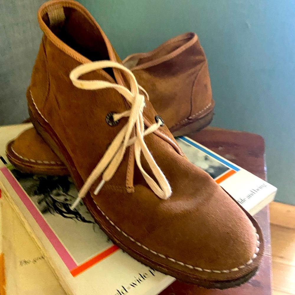 Soft Italian leather lace up booties with rubber heel.